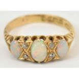 An 18ct yellow gold opal and diamond ring, size L/M, 2.1g.