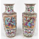 A pair of Canton Famille Rose vases with polychrome decoration, height approx. 35.5cm (2).