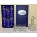 A set of six Royal Doulton crystal wine glasses, together with a cut glass decanter and six cut