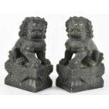 A pair of Chinese carved soapstone figures of Fo dogs, height 15.5cm.