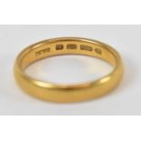 A 22ct yellow gold wedding band, size O, 5.2g.