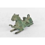 A Chinese verdigris bronze candlestick modelled as a beast, length 15cm.