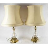 A pair of brass and cut glass table lamps, height 50cm.