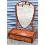 A fine Edwardian satinwood and mahogany toilet mirror, the shield shaped plate supported on a base