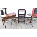 A small early 19th century mahogany tripod table, a late George III mahogany fold over card table