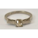 An 18ct and platinum diamond set solitaire ring, size O, 3.9g.