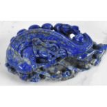 A Chinese lapis lazuli carving of a dragon, 7 x 4.5cm.