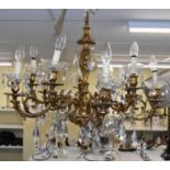 A pair of French style gilt brass chandeliers with cut glass drops, height 65cm.