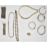 A group of hallmarked silver jewellery including bangles, necklaces, fobs, combined approx 195g.