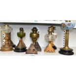 Six assorted Victorian and later oil lamps, also four oil lamp bases, height of tallest 37cm.