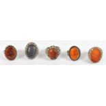 A group of five Islamic silver stone set intaglio rings, combined approx 77.6g (5).