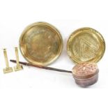 A 19th century copper pierced warming pan, two Eastern brass chargers, diameter 50cm, and a pair