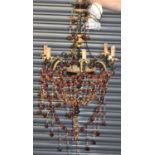 A modern decorative chandelier, decorated with colourful glass beads, height approx 80cm.