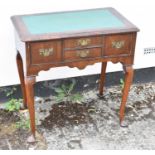 An 18th century walnut lowboy, with later inset top above four herringbone banded drawers on