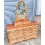 A reproduction dressing chest, the removable bevelled mirror back with two hooks and three frieze