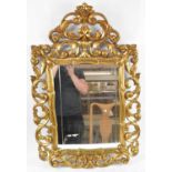 A 19th century French ornate gilt framed wall mirror, 99 x 61cm.