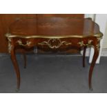 A early 20th century French inlaid writing table with gilt metal mounts and single frieze drawer,