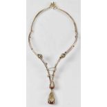 An Indian yellow and white gold diamond and black onyx set torc necklace with twin graduated and