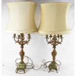 A pair of gilt spelter and onyx table lamps, converted from six light candelabra, height 68cm.
