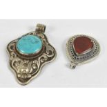 Two Eastern white metal brooches set with semi-precious stones, the larger 7.5cm.