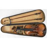 A full size German violin with one-piece back, length 35.8cm, bears label 'Richard Freidl Absroht