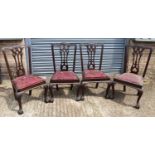 A set of four early 20th century mahogany Chippendale style dining chairs on carved cabriole legs