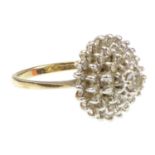 A 9ct gold diamond cluster ring in the form of a cascading cone set with approximately fifty small