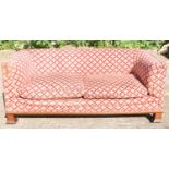A late 19th century upholstered Chesterfield sofa on substantial square supports, width 180cm.