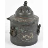 An Islamic copper and silver inlaid circular pot with cover, height 13.5cm.