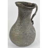 A large Eastern pewter jug, possibly Afghanistan, height 33.5cm (af).