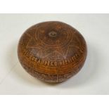 A Peruvian folk art gourd rattle, height 5cm, width 10cm.