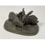 AFTER PIERRE-JULES MȆNE; a late 19th century bronze figure group 'Feeding Hares' with signature to