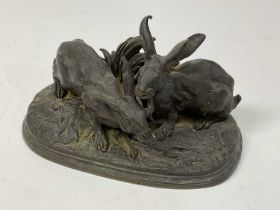 AFTER PIERRE-JULES MȆNE; a late 19th century bronze figure group 'Feeding Hares' with signature to