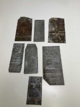 A quantity of assorted cast metal printing plates, advertising related.