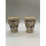 SEVRES; a pair of late 19th century gilt heightened floral painted ribbed vases, both with painted