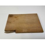 A Mouseman cheeseboard with cheese knife. Condition Report: There is a small amount of staining,