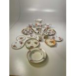 A group of decorative ceramics including a Royal Worcester blush ivory scallop moulded dish, a mid