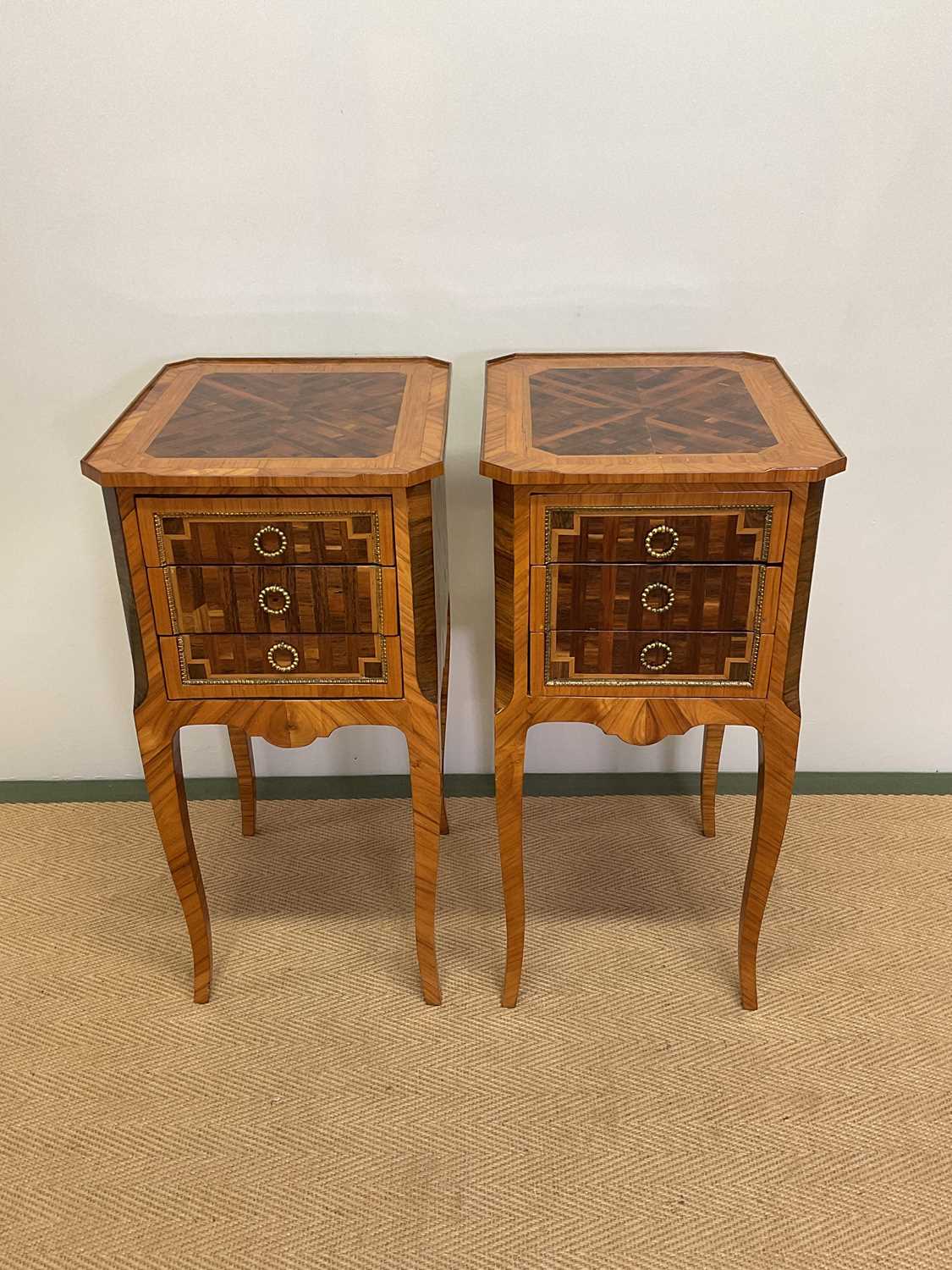 A pair of 18th century and later French tulipwood, rosewood and parquetry tables en chiffonnière,