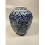 A late 18th century Dutch Delft vase of octagonal ovoid form decorated with stylised flowers and