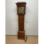 An early 19th century oak and mahogany crossbanded thirty hour longcase clock, the brass dial set