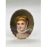 An oval porcelain hand painted plaque depicting Princess Louise, daughter of Queen Victoria and