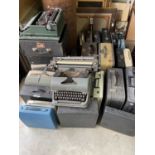 A large quantity of vintage typewriters.