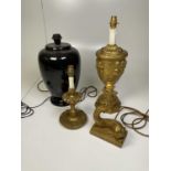 Three gilt decorative lampbases and a black ceramic lampbase.