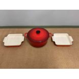 LE CREUSET; a cast iron large casserole and two roasting dishes.