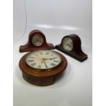 A circa 1900 oak cased circular thirty hour wall clock with Roman numerals to the dial, width