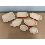 LE CREUSET; seven ceramic ovenware dishes of various sizes.