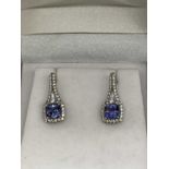 A pair of silver tanzanite and zirconia earrings, the twin tanzanite combined weighing approx. 2.