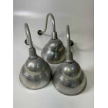 Three industrial aluminium wall lights