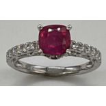 An 18ct white gold ruby and diamond ring, the natural unheated Burmese ruby weighing 1.52cts