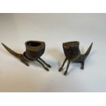 A pair of zoomorphic horns decorated with brass mounts and supports in the form of hooves (2)